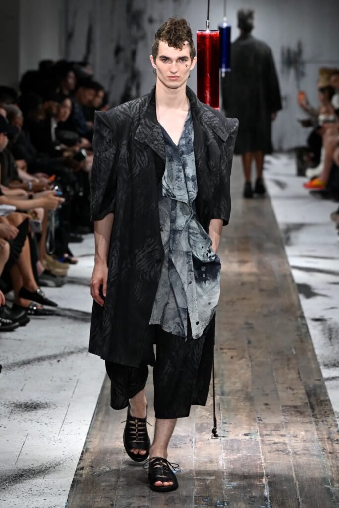 Yohji Yamamoto showed elongated jackets with pronounced shoulders as a key look at his 2027 Pour Homme Spring/Summer Show.